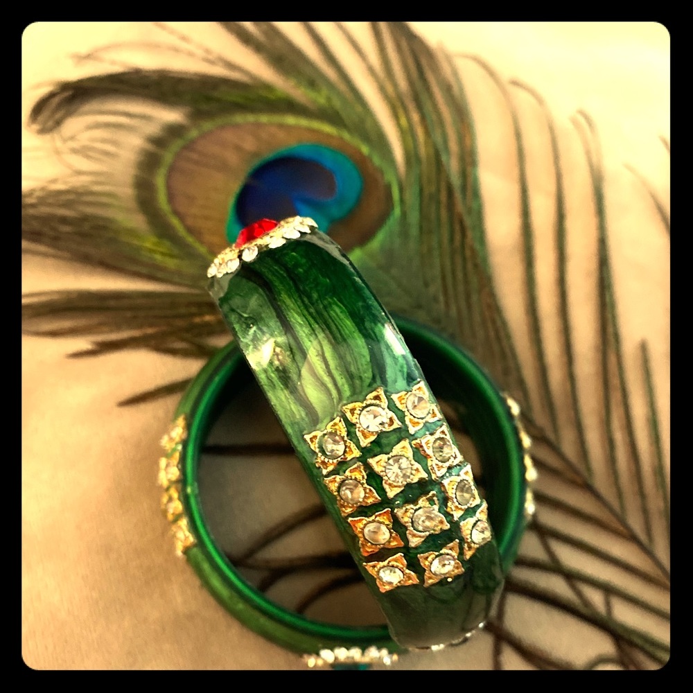 A gorgeous pair of ornate glass bangles.